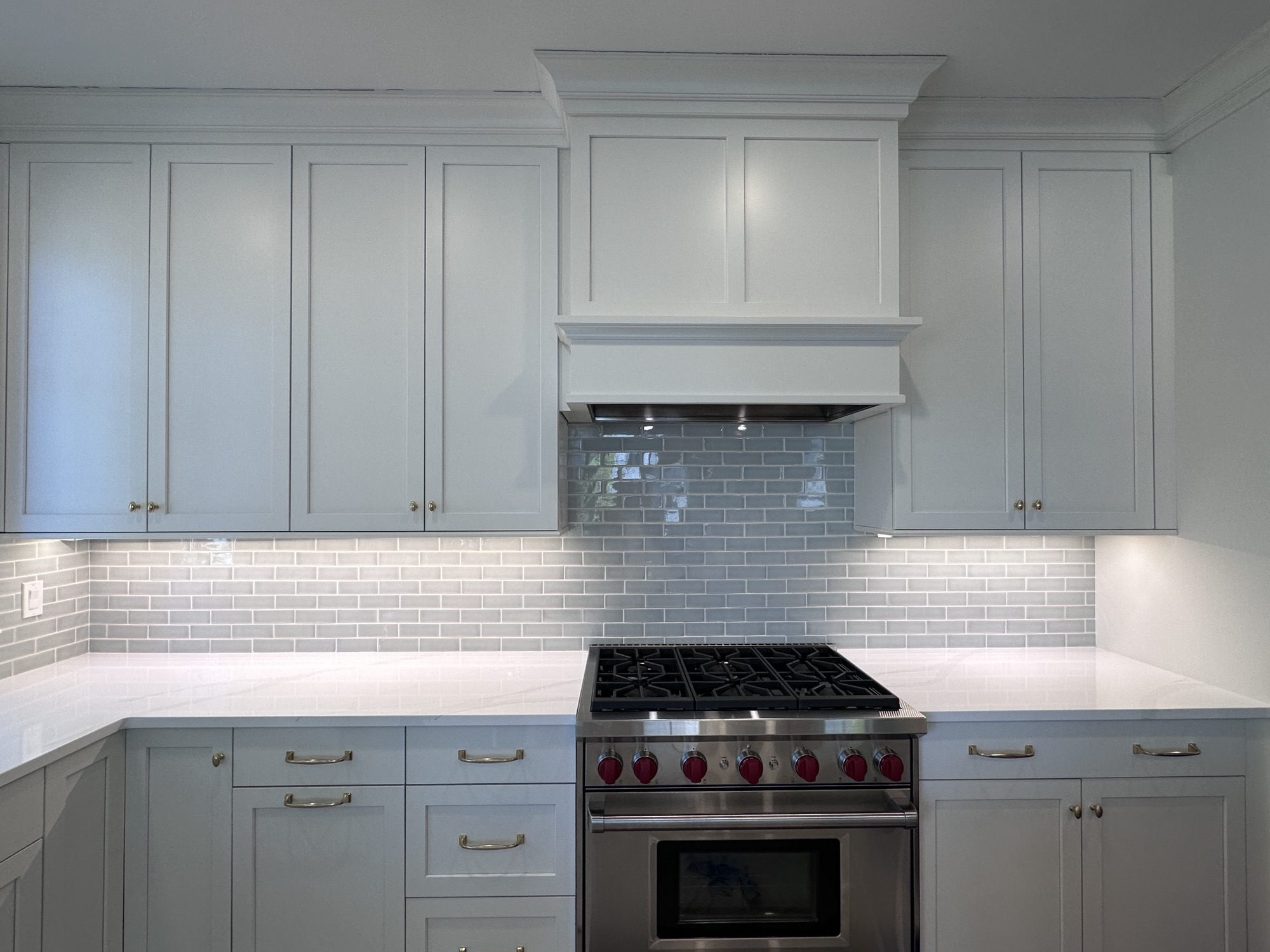 Backsplash tile installation in Newton, MA — wide view of completed kitchen backsplash