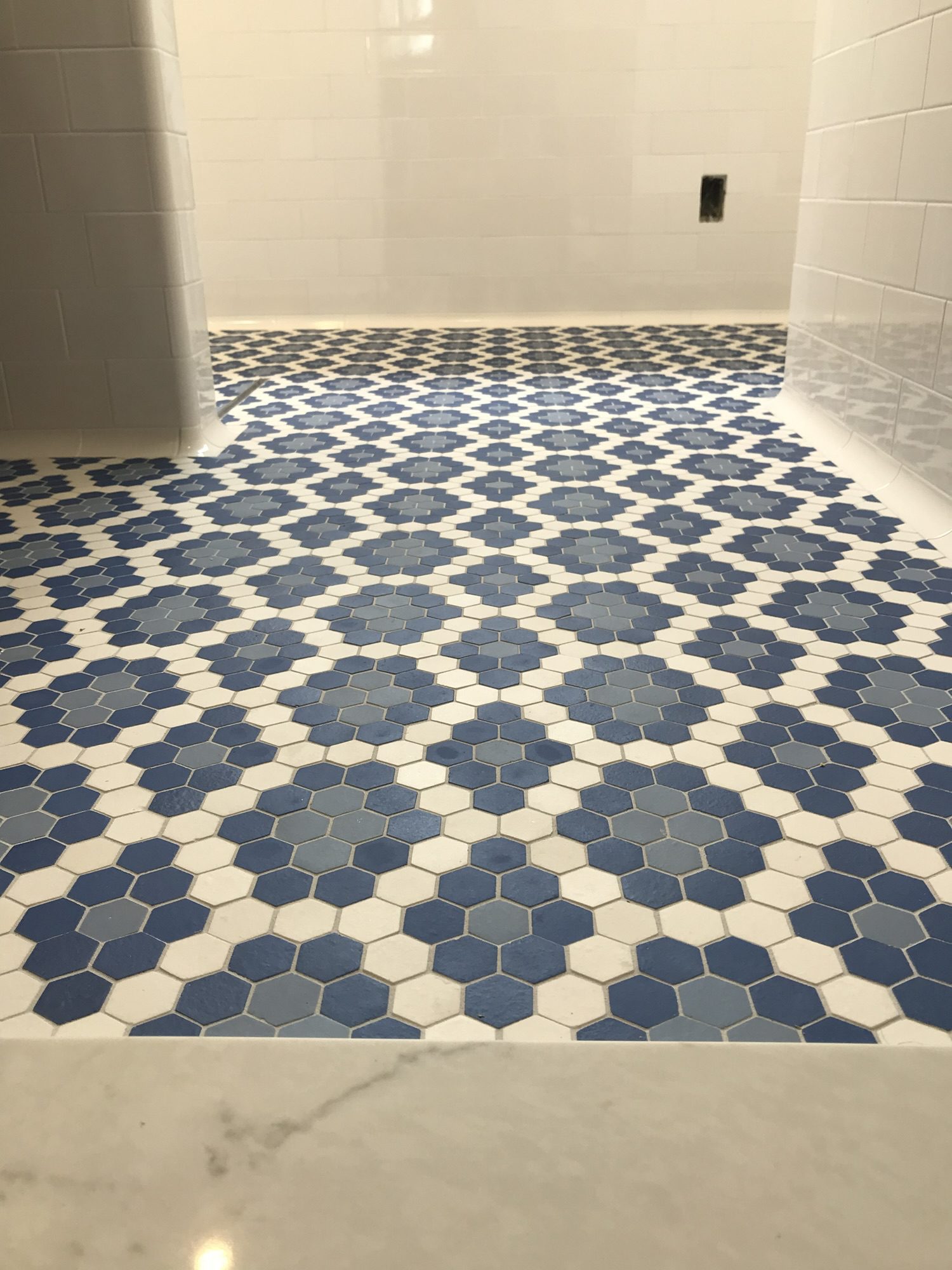 American Restoration Tile hex mosaic floor with curbless linear drain — Newton Centre, MA bathroom by Davie Mac Tile
