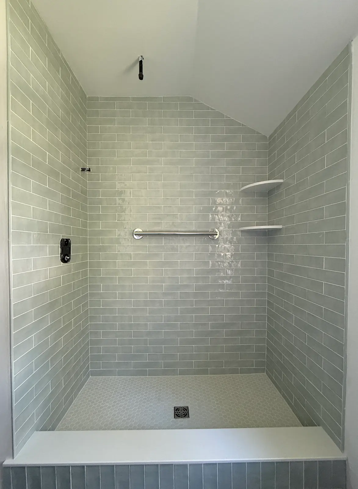 2x8 Gray subway tile on walls installation