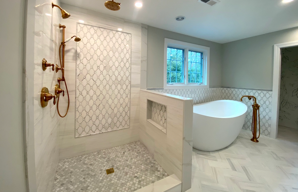 Elegant Custom Bathroom Tile Design With Gold Fixtures and Marble Accents by Davie Mac Tile