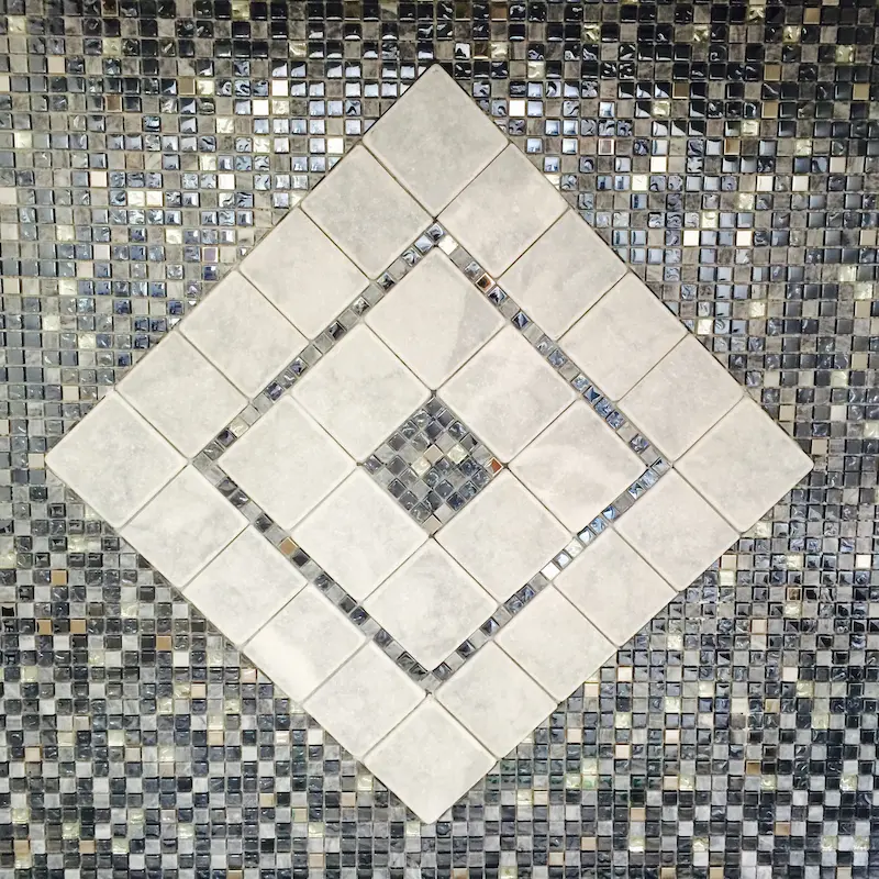 Close-up of a custom mosaic tile design showcasing intricate craftsmanship and precision installation