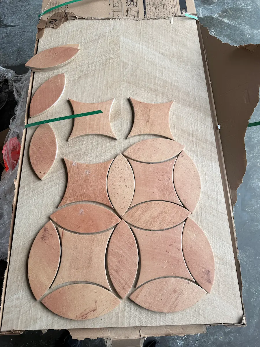 loose Natucer Colonial petal and kite pieces laid out for a petal mosaic porch floor in Dover MA
