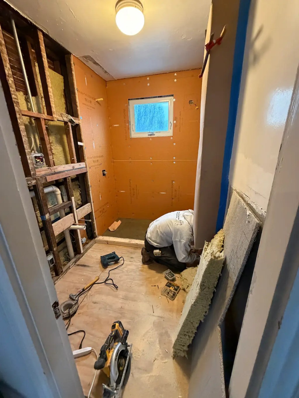 Schluter waterproofing board installed on Somerville shower walls over a rebuilt subfloor