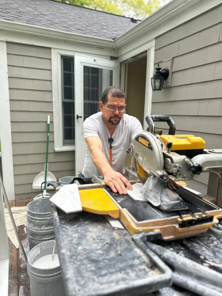 About Davie Mac Tile - Hingham, MA - Leandro - Tile Installer Using Wet Saw for Precision Cuts